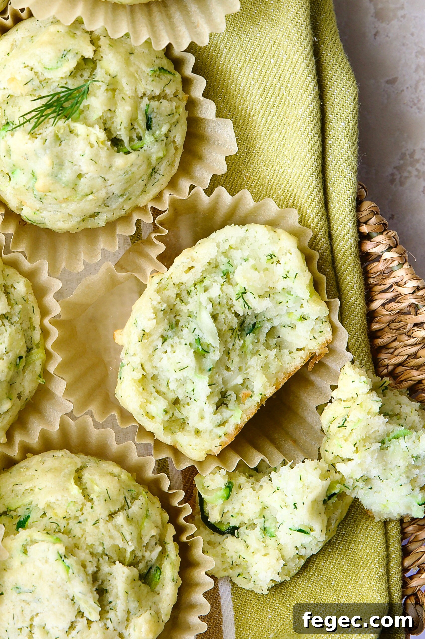 Close-up of Dill Zucchini and Ricotta Muffin broken into pieces.
