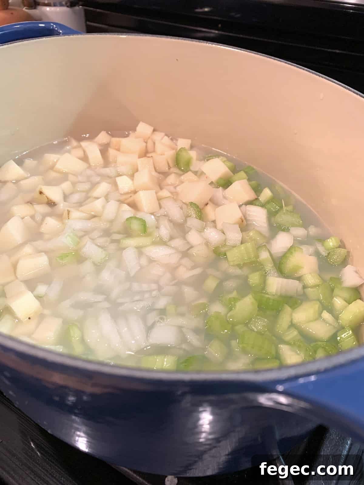 Chowder ingredients in a pot on the stove.
