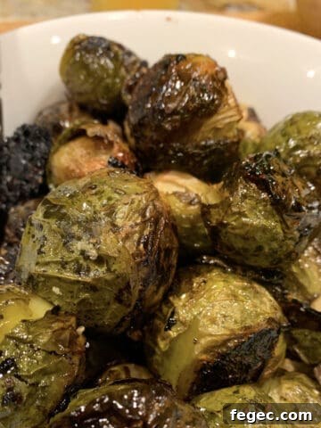 A bowl of brussels sprouts glazed with balsamic vinegar and soy sauce.