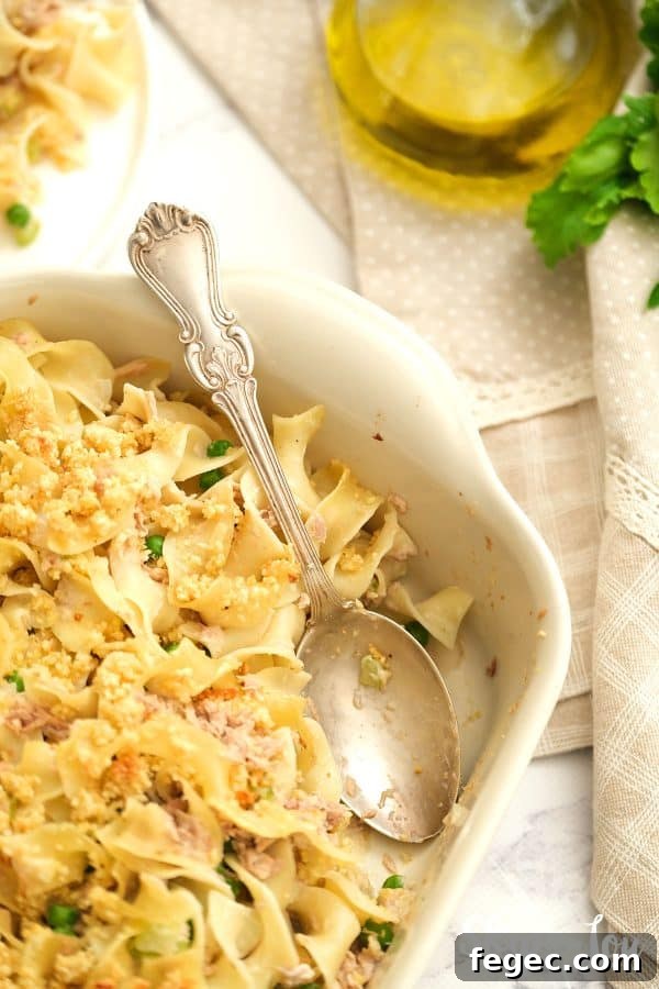 Dish of Tuna Noodle Casserole with serving spoon.
