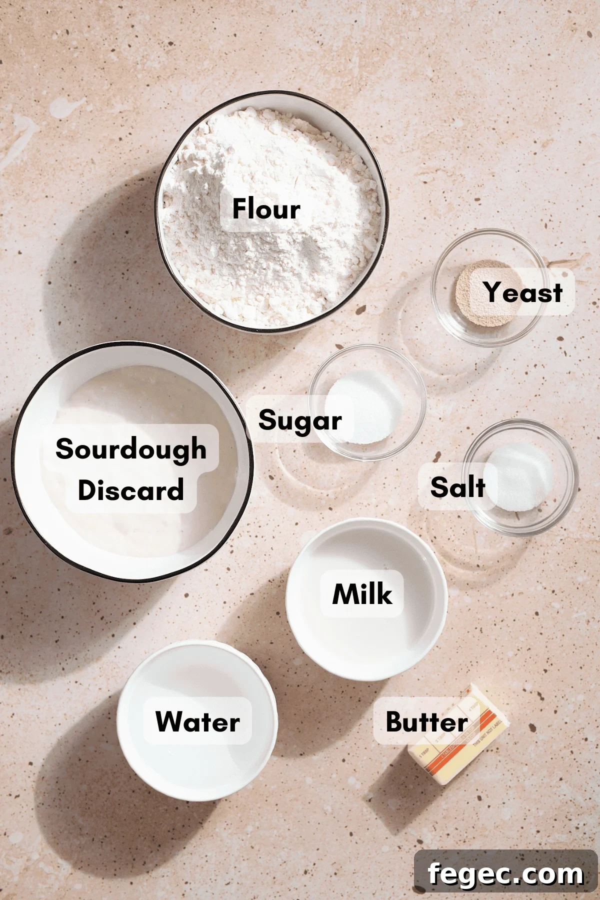 Ingredients for Sourdough Discard Sandwich Bread in small bowls. 