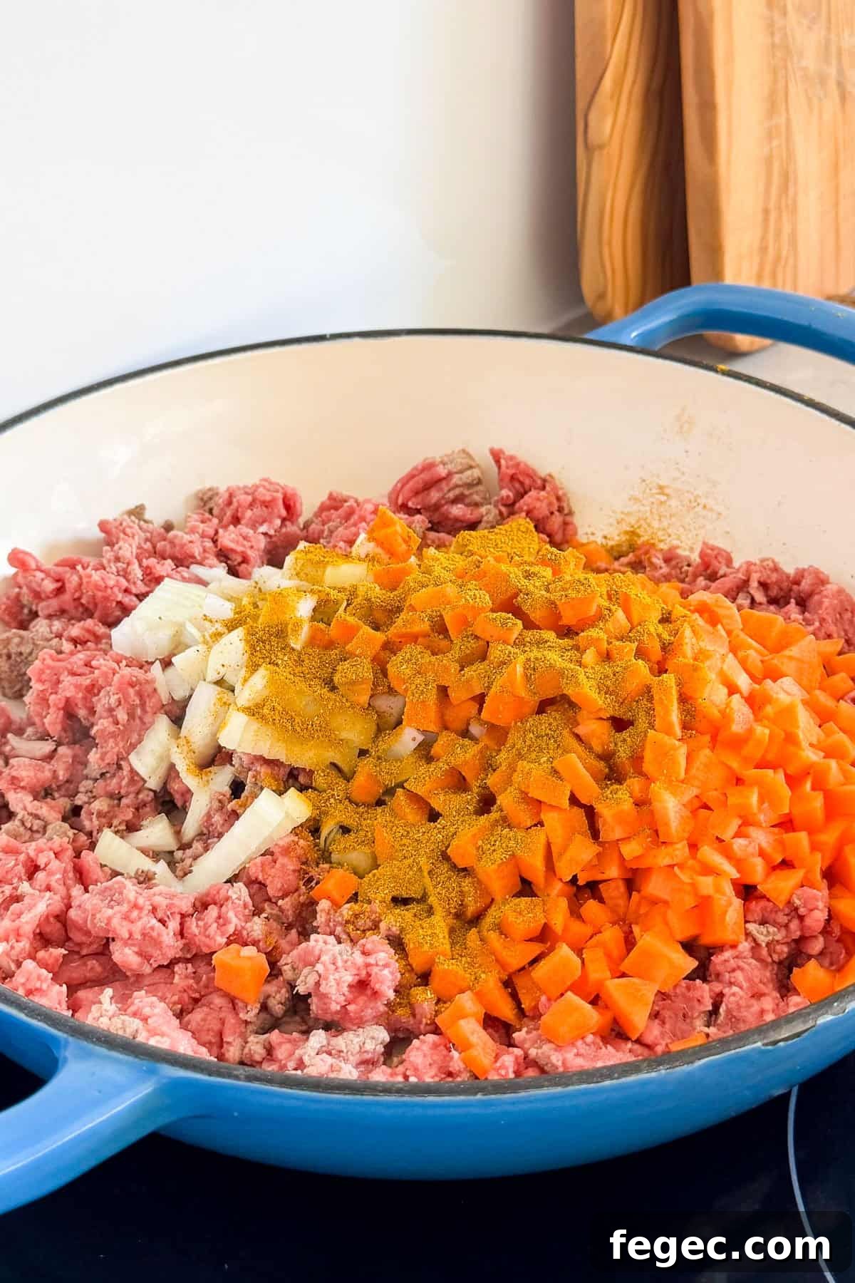 Carrots, onions and curry powder added to the meat.