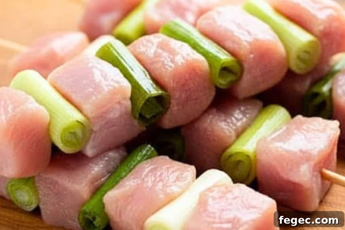 Alternate chicken cubes and onion pieces.