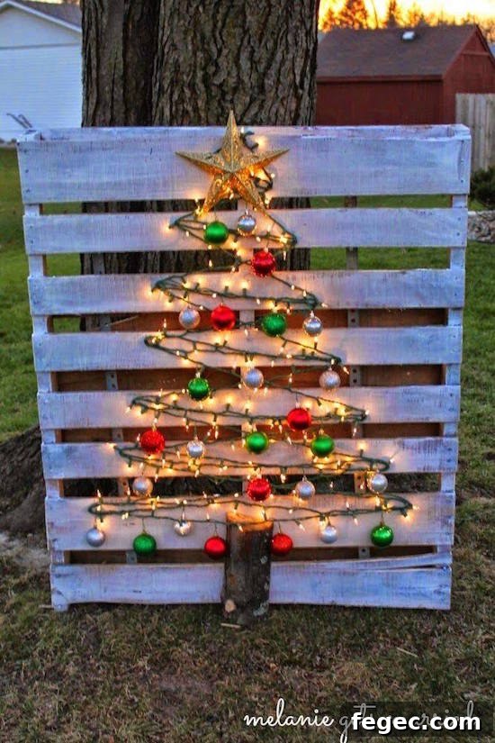 Star light, star bright, this wood pallet glows at night! Oh my gosh- I love that this DIY pallet Christmas tree is a little bit rustic, a little bit traditional, and 100% beautiful. Make it once and use it year after year!