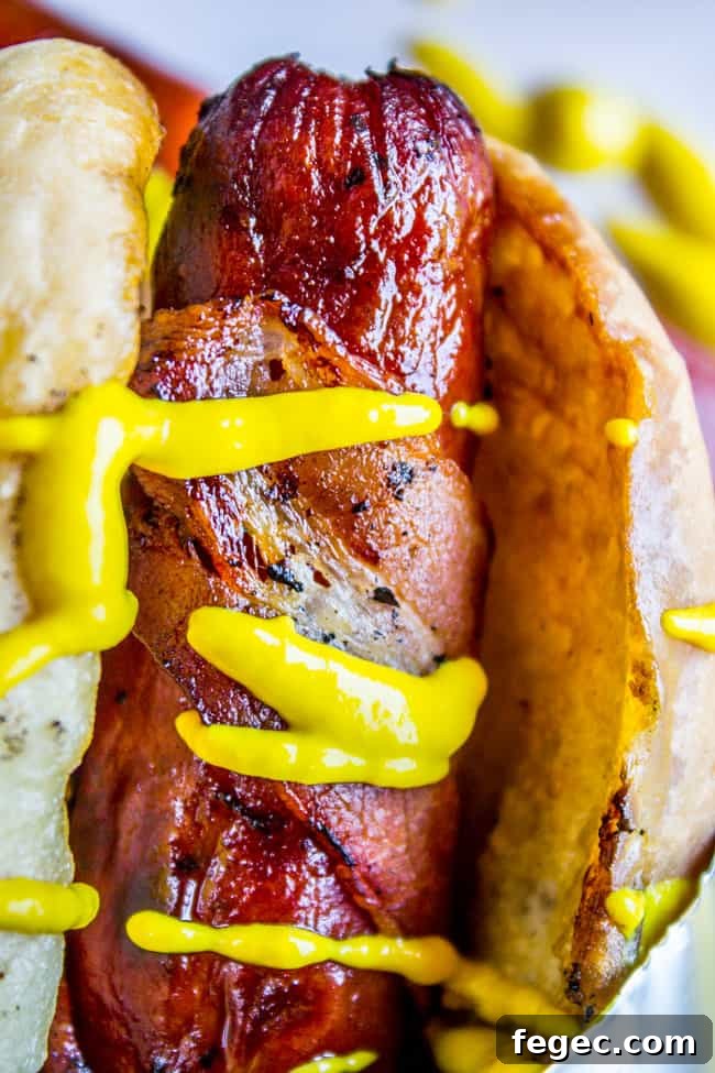 Grilled Bacon-Wrapped Hot Dogs: Crispy, Juicy Summer Recipe 3 Bacon Wrapped Hot Dogs (Grilled) from The Food Charlatan