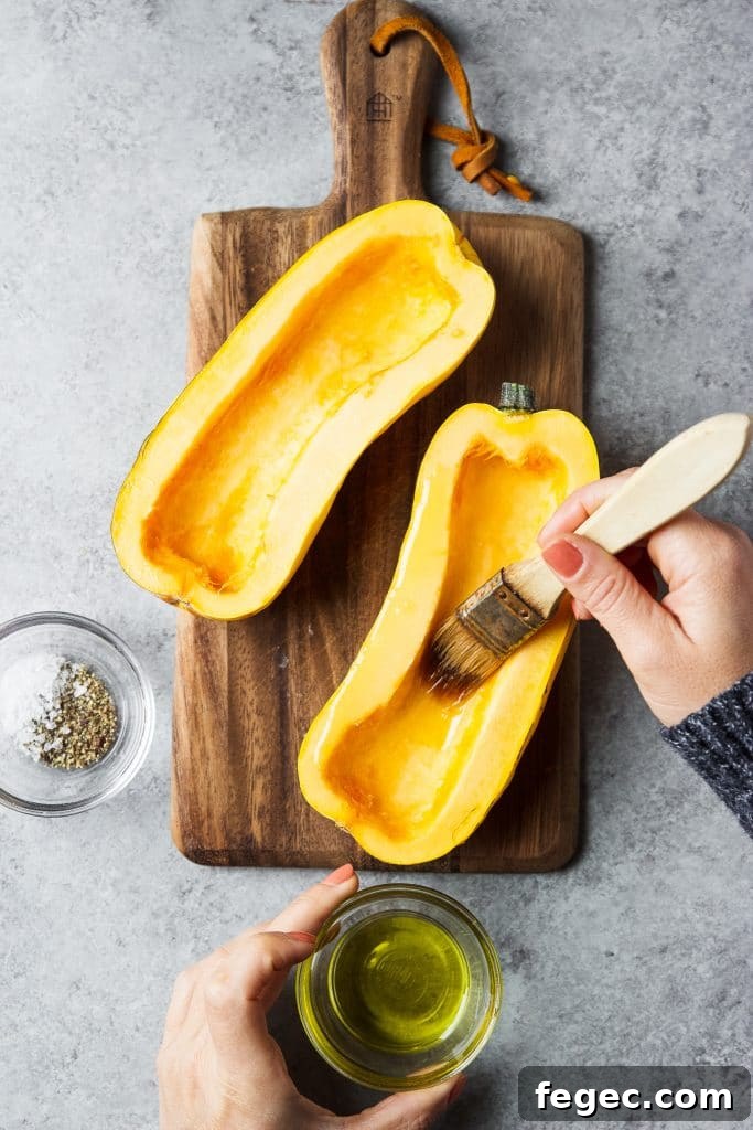 delicata squash being brushed with olive oil