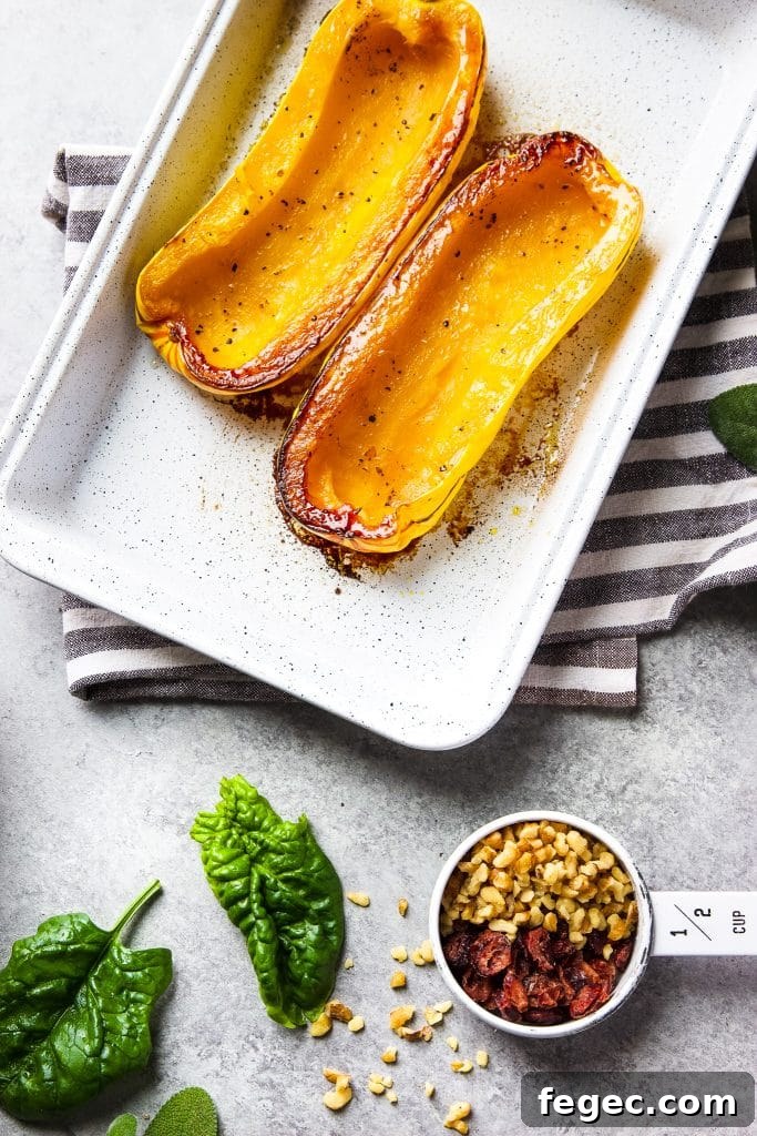 roasted delicata squash out of the oven. Ingredients on the table