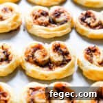 side close up of savoury palmiers on white surface