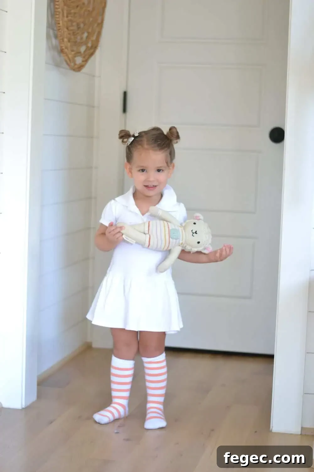 little girl holding teddy bear