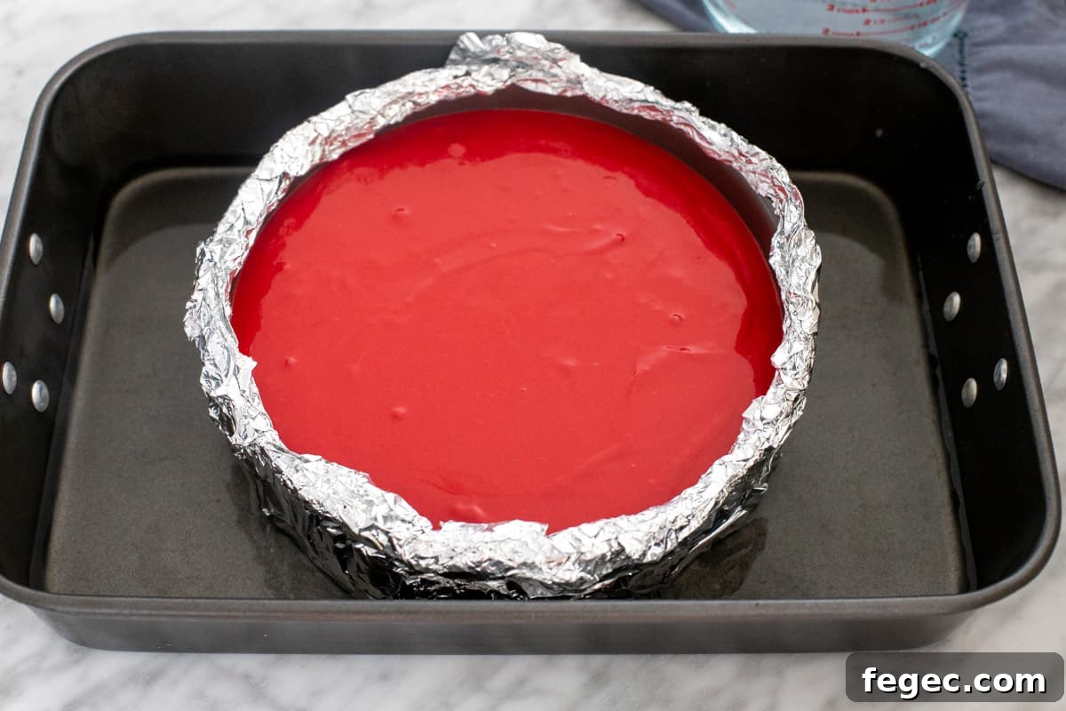 Unbaked cheesecake in a water bath