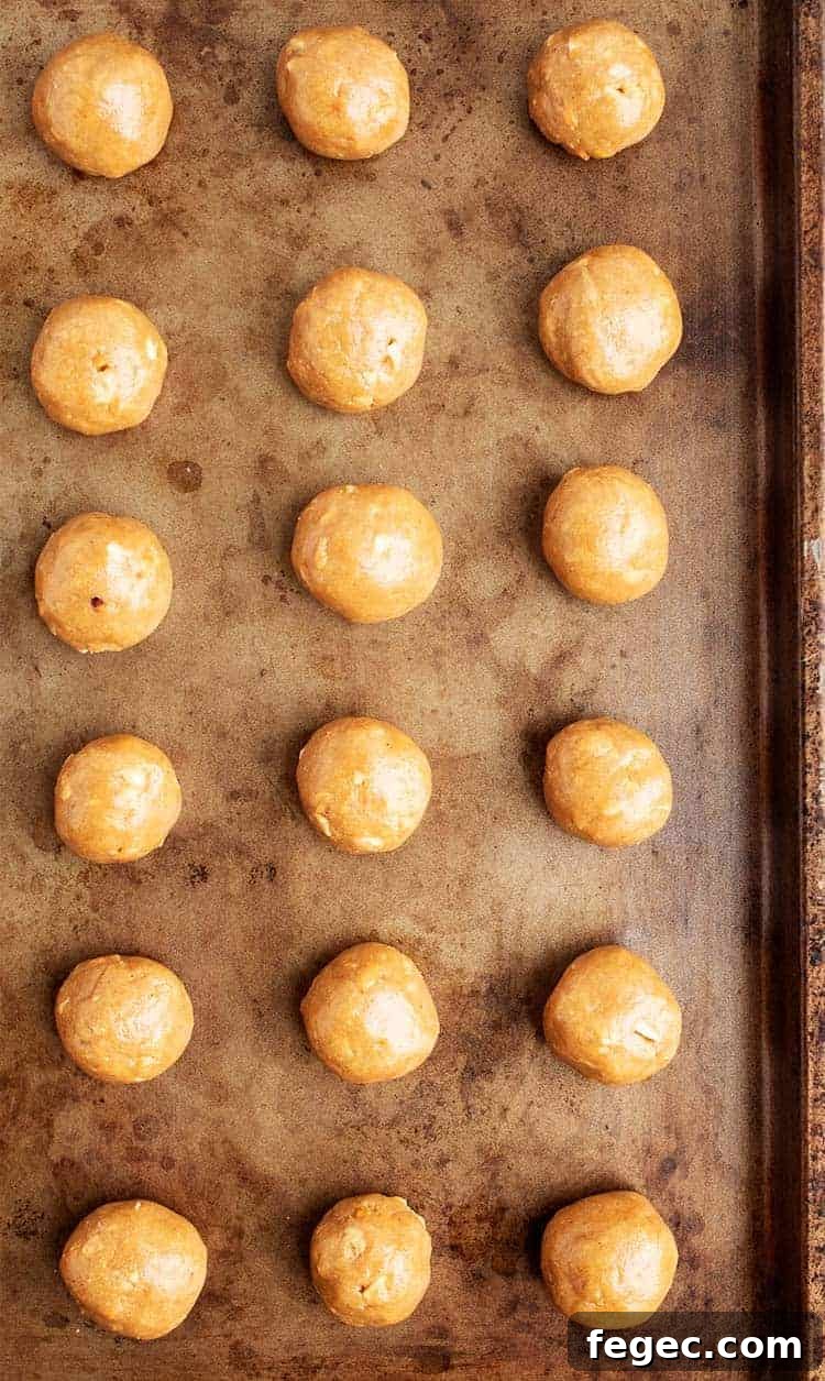 overhead view of 3 ingredient peanut butter balls on cookie sheet