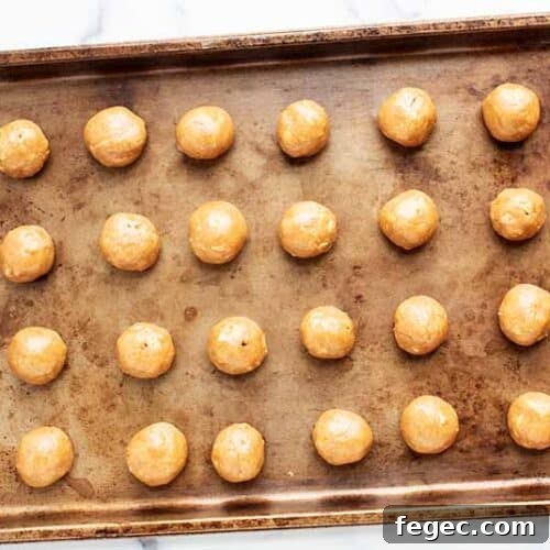 3 ingredient peanut butter balls on a baking tray