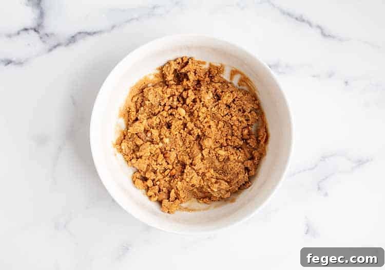 white bowl with 3 ingredient peanut butter balls batter