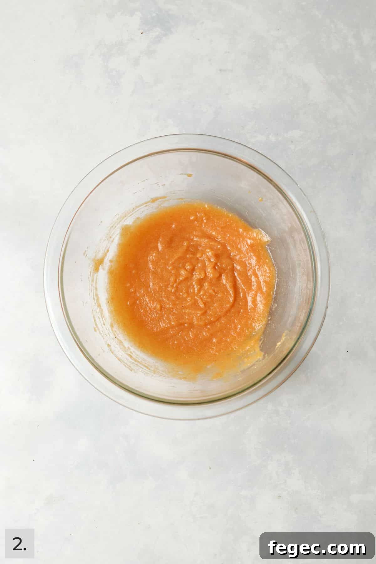 Single-Serve Pumpkin Coffee Cake Recipe (Small Batch) 5 Pumpkin, melted butter, egg yolk, and milk mixed together in a mixing bowl.