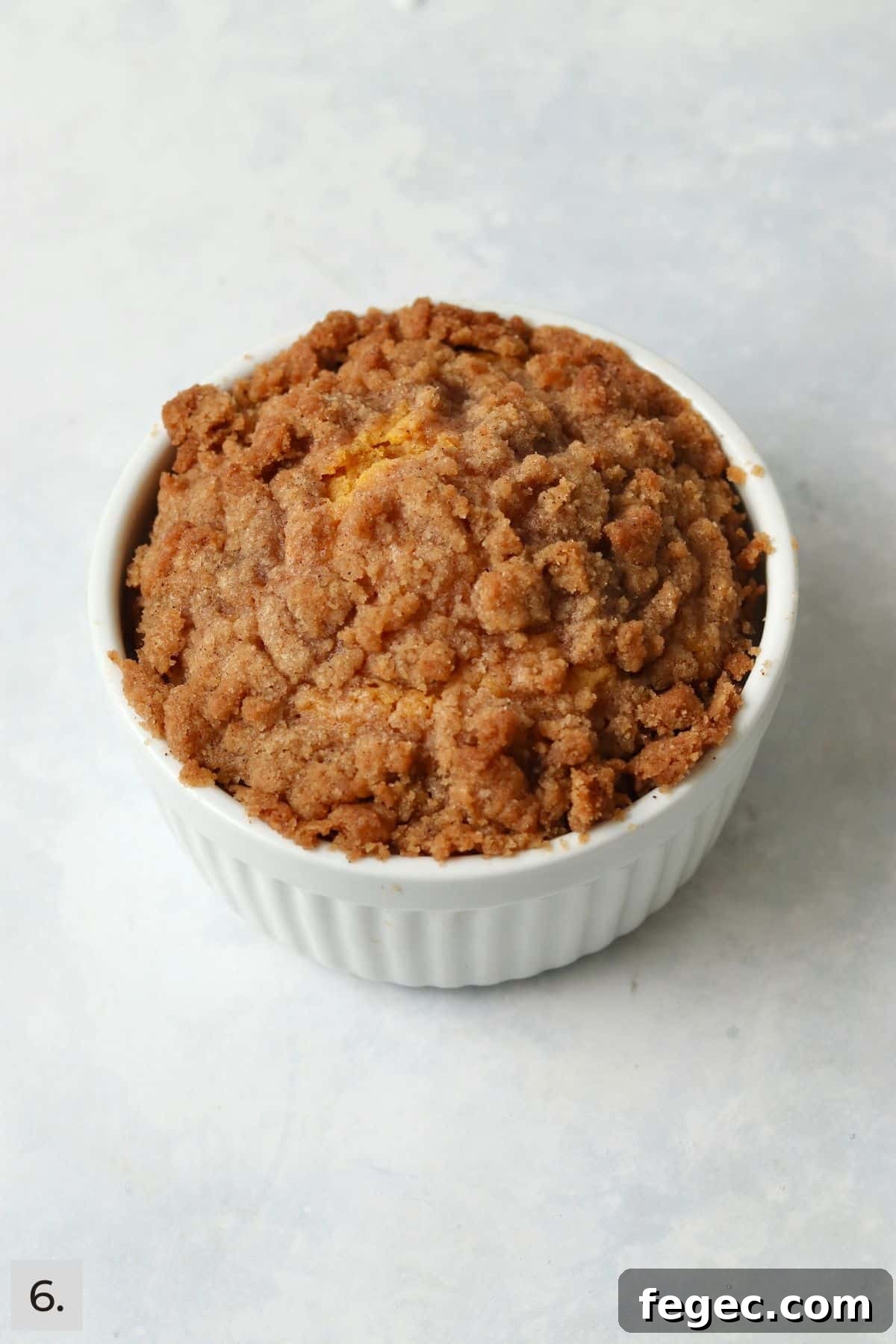 Single-Serve Pumpkin Coffee Cake Recipe (Small Batch) 9 Baked pumpkin coffee cake with streusel in a ramekin.