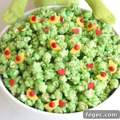 grinch popcorn in a white bowl