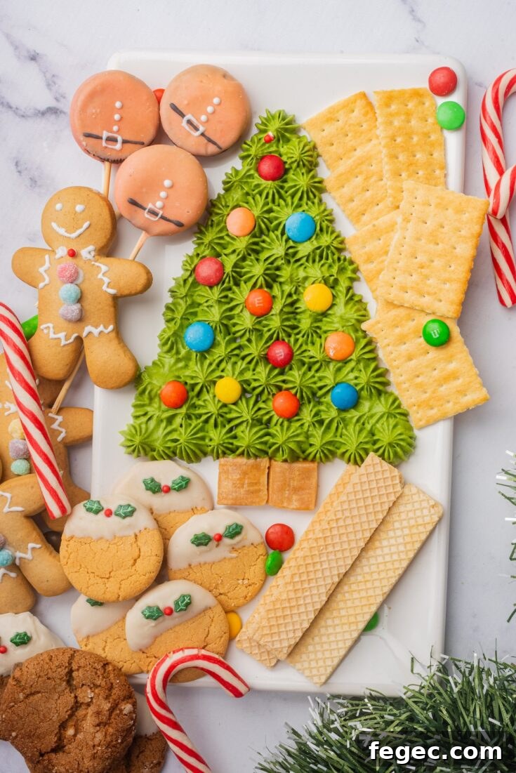 the finished christmas tree frosting board served with a variety of dippers.