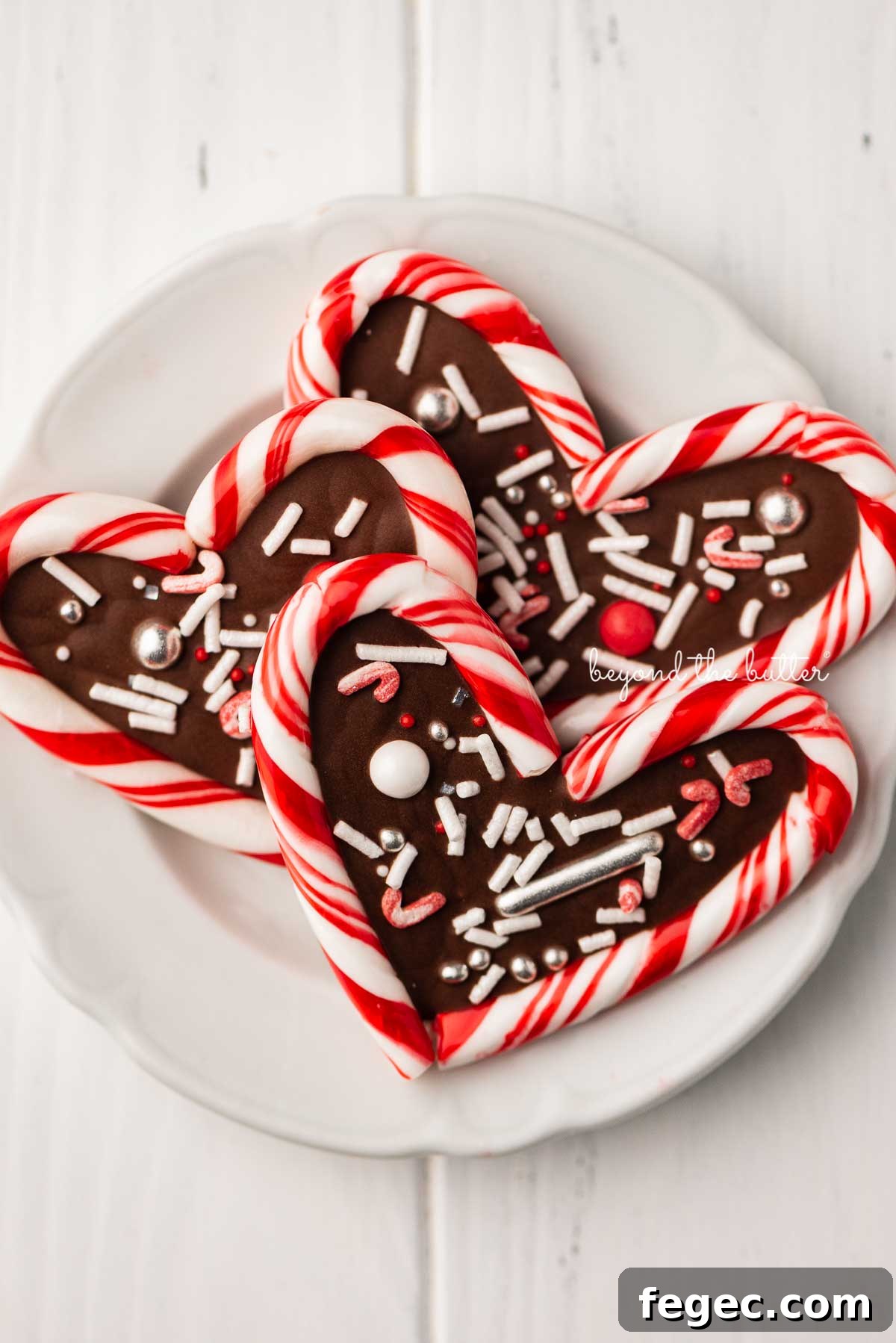 Close up of candy cane hearts on dessert plate | © Beyond the Butter®