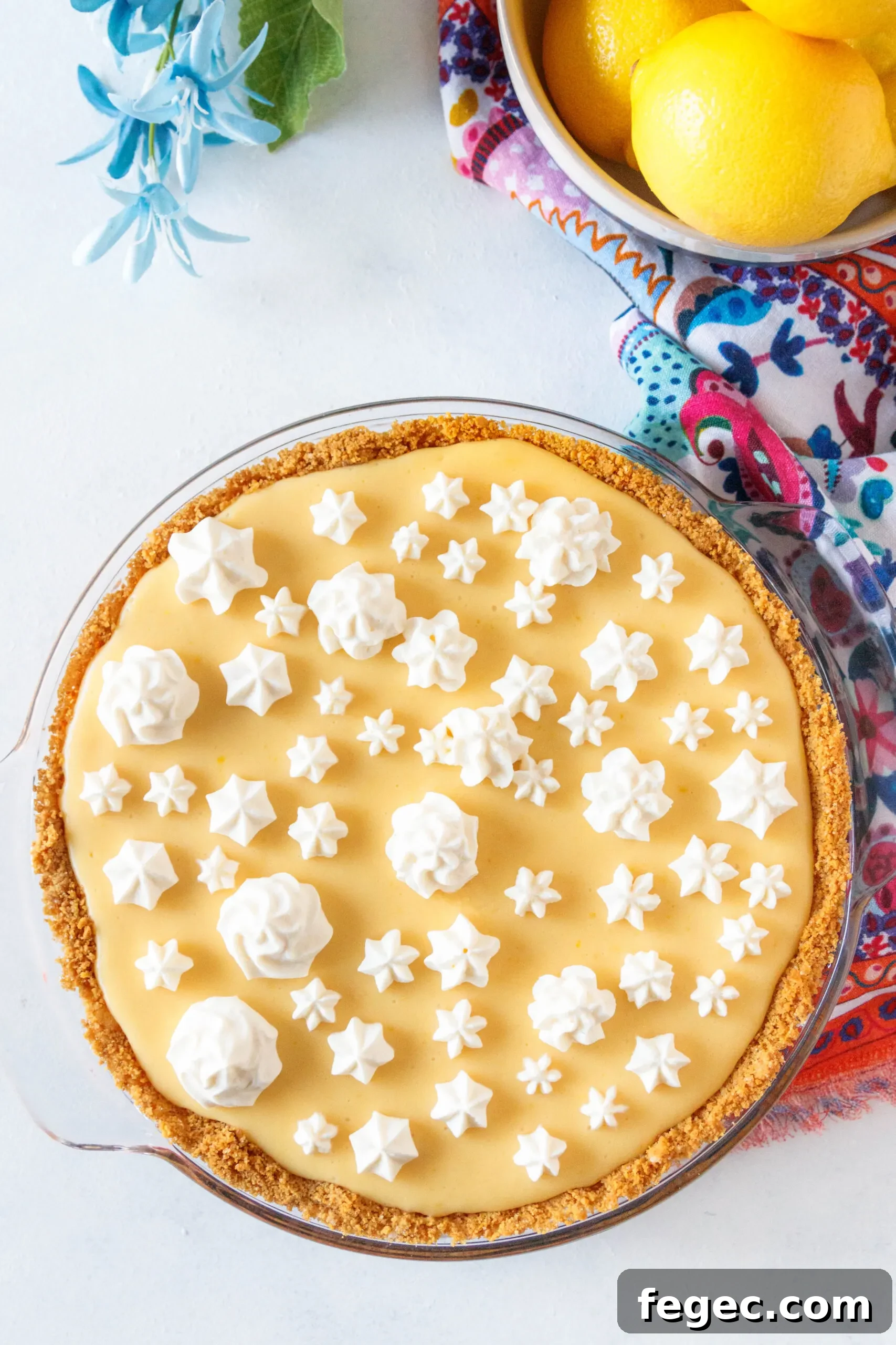 overhead view of the pie, before slicing, to show the pretty swirls of whipped cream