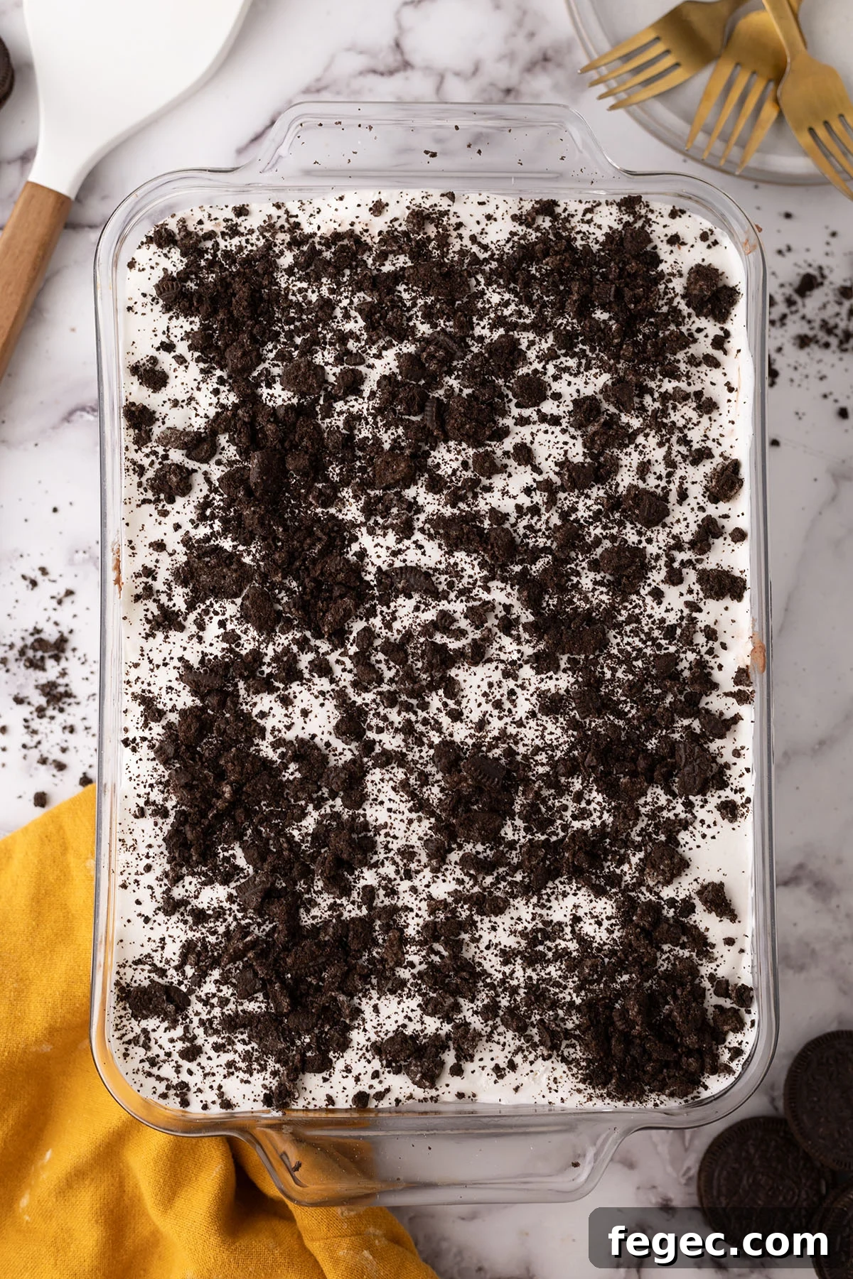 A layer of crushed Oreos on top of chocolate lasagna.