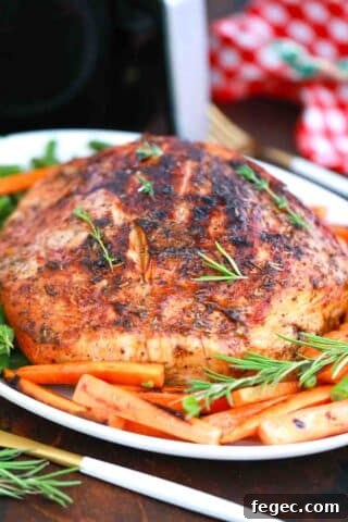 air fried turkey breast on a platter with veggies