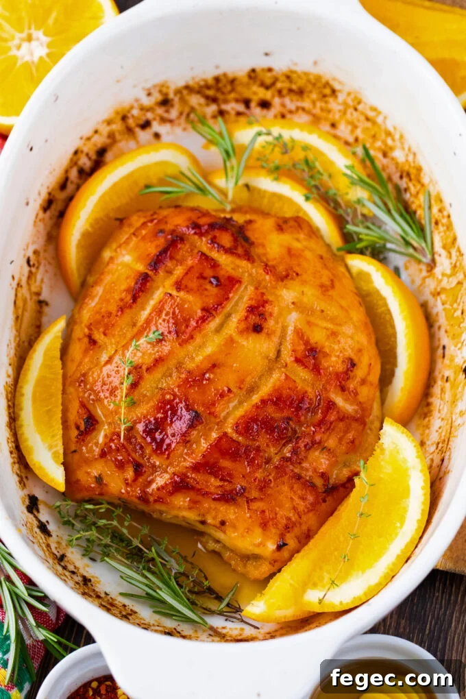Oven-Roasted Turkey Breast with Honey Orange Glaze 9 Overhead shot of oven roasted turkey breast with oranges and herbs.