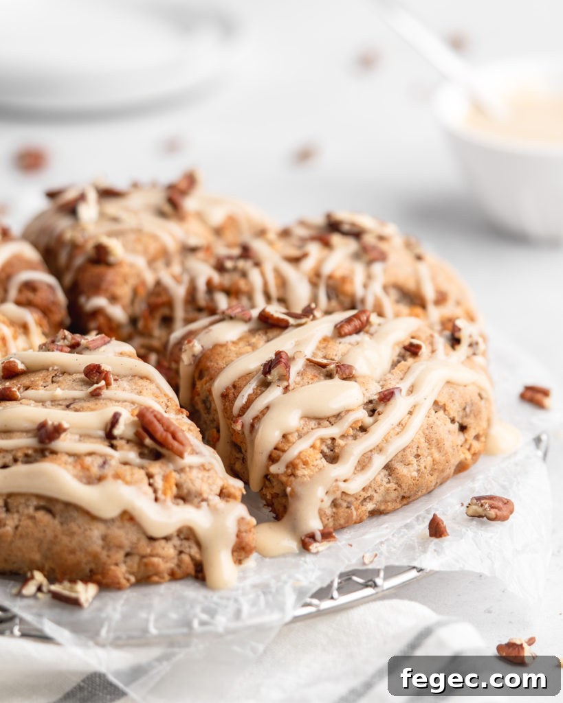 These carrot cake cones are sweet, heart warming, and delicious! With pecans and maple cream cheese glaze