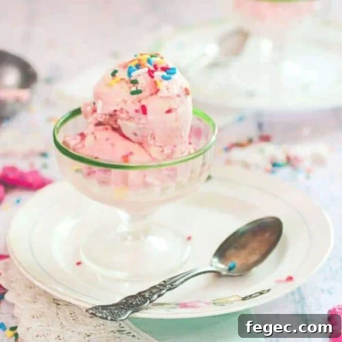 Pink ice cream in a vintage glass ice cream dish.