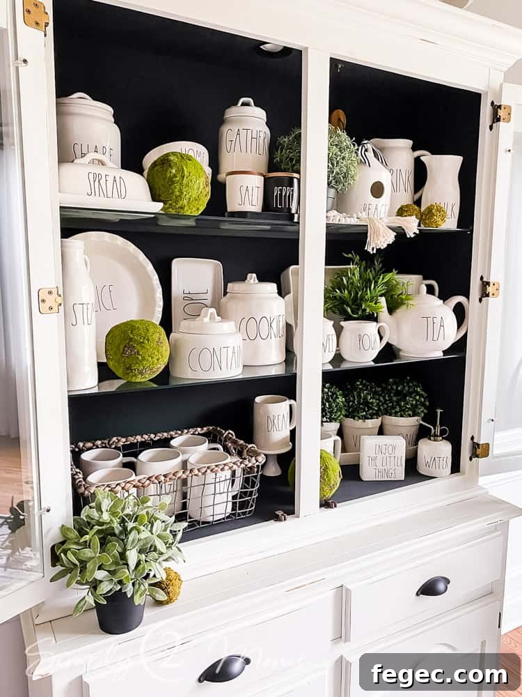 Spring Dining Room Ideas for Greenery Lovers 10 china cabinet hutch decorated for spring with stoneware and greenery