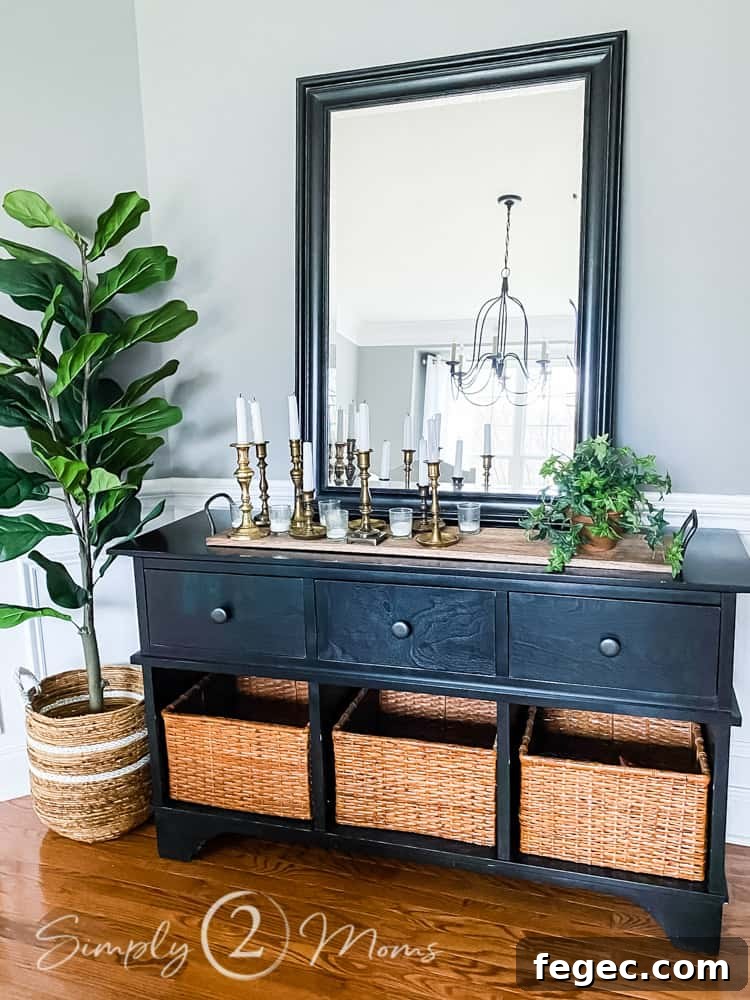 Spring Dining Room Ideas for Greenery Lovers 6 view of buffet table in dining room decorated for spring with candles and faux plants