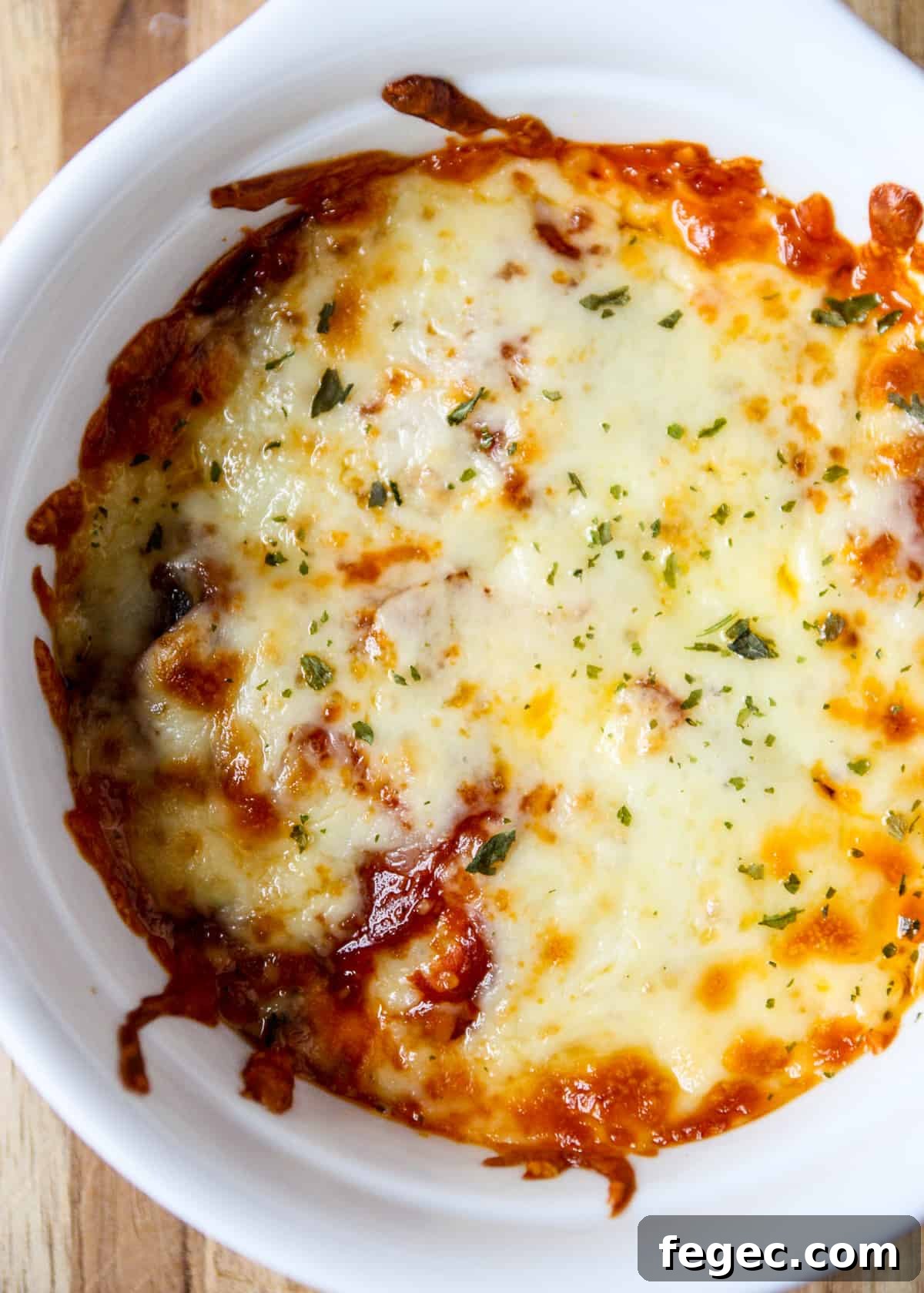 A close up of a baked pizza bowl.