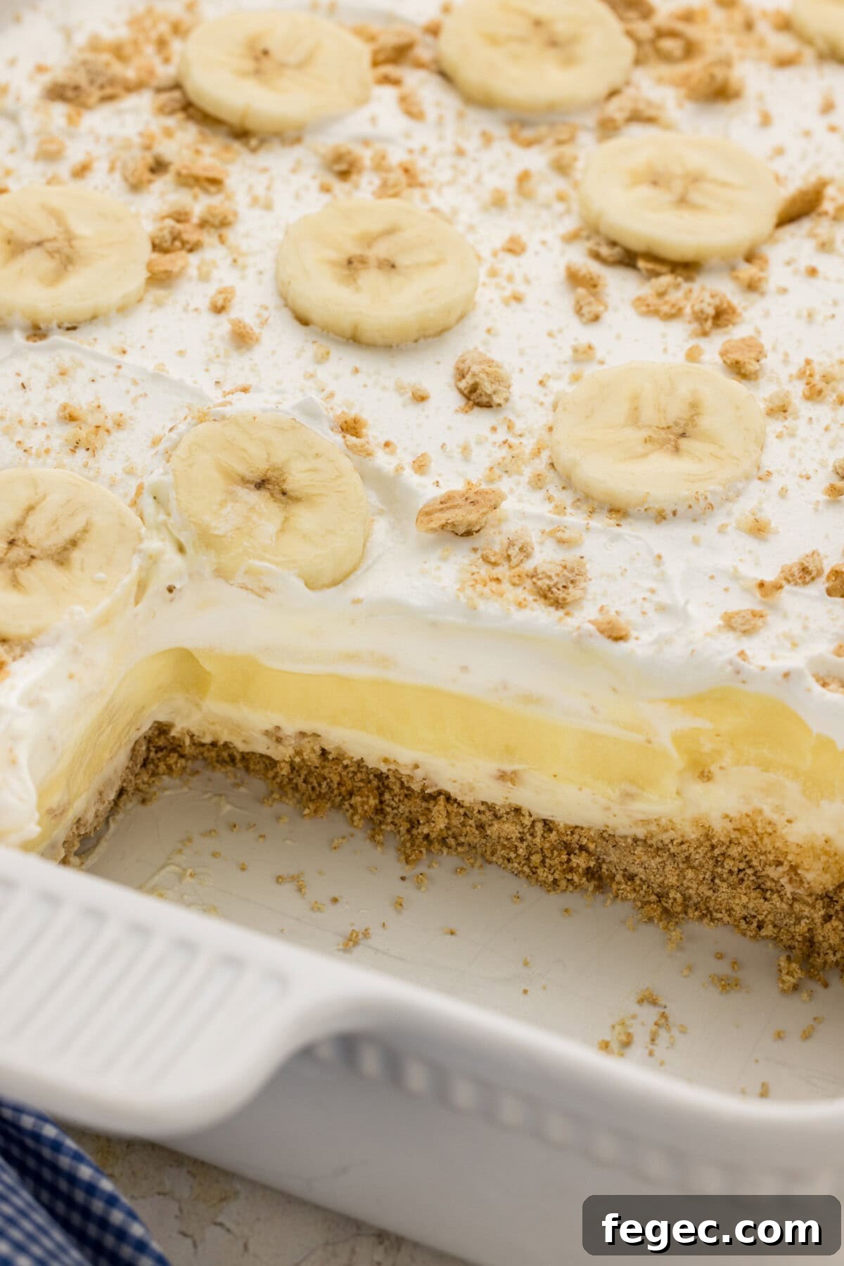 pan of Banana Cream Lush with a couple slices removed