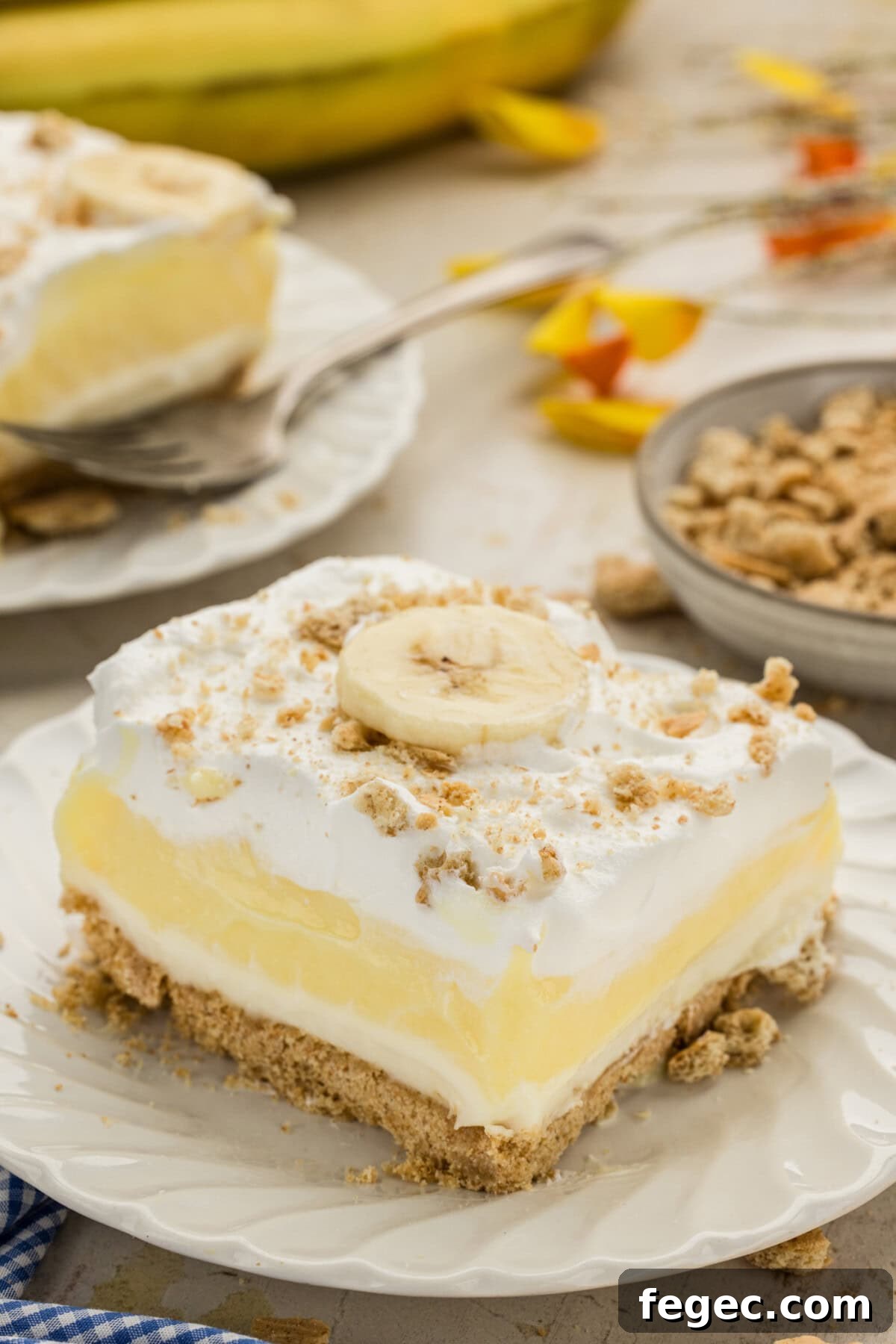 slice of Banana Cream Lush on a white plate