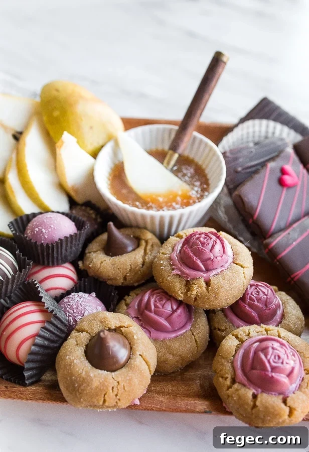 Dessert charcuterie board with cookies, pears, and caramel sauce.