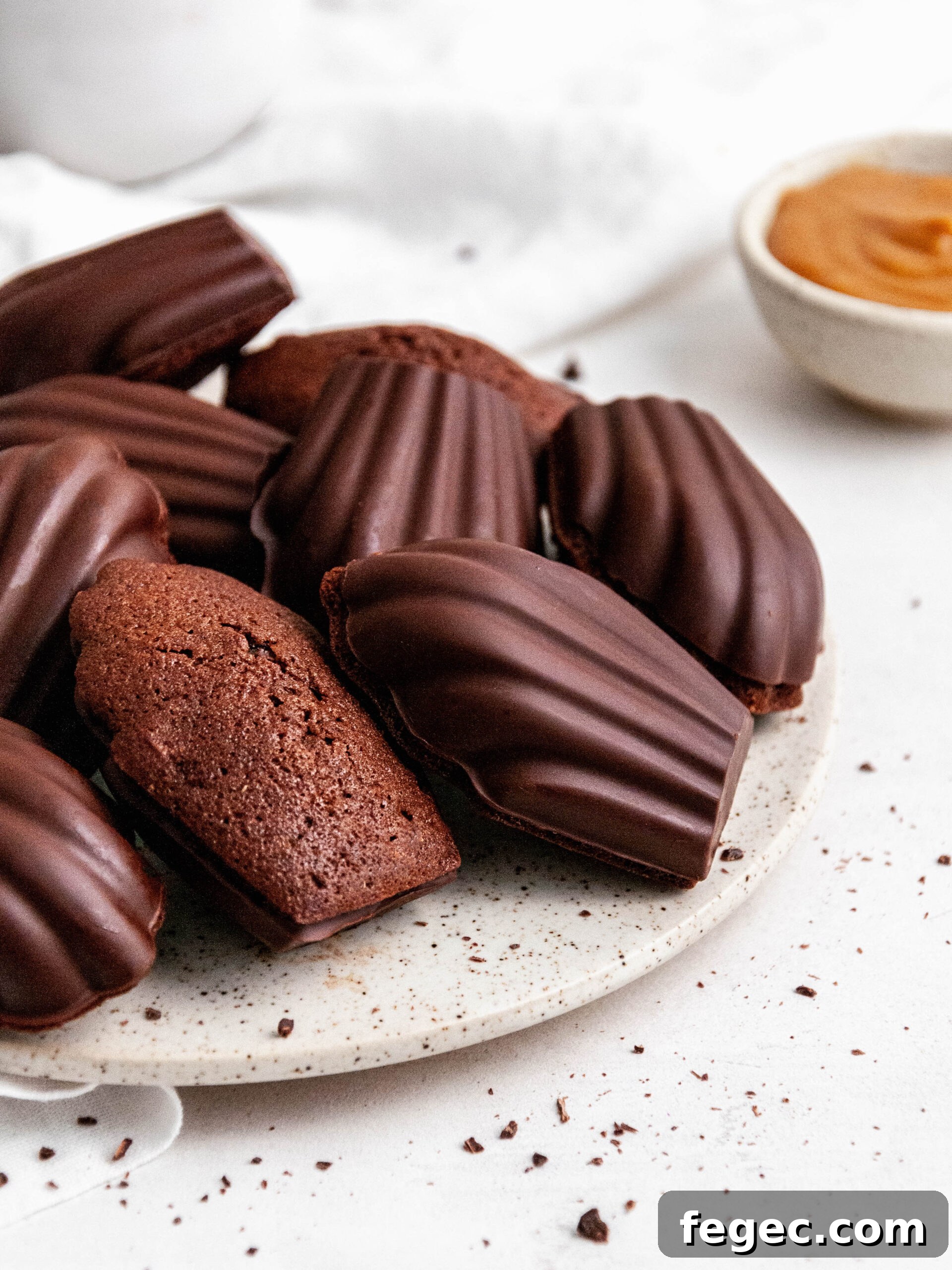 Chocolate madeleines with Dulce de Leche on a plate.