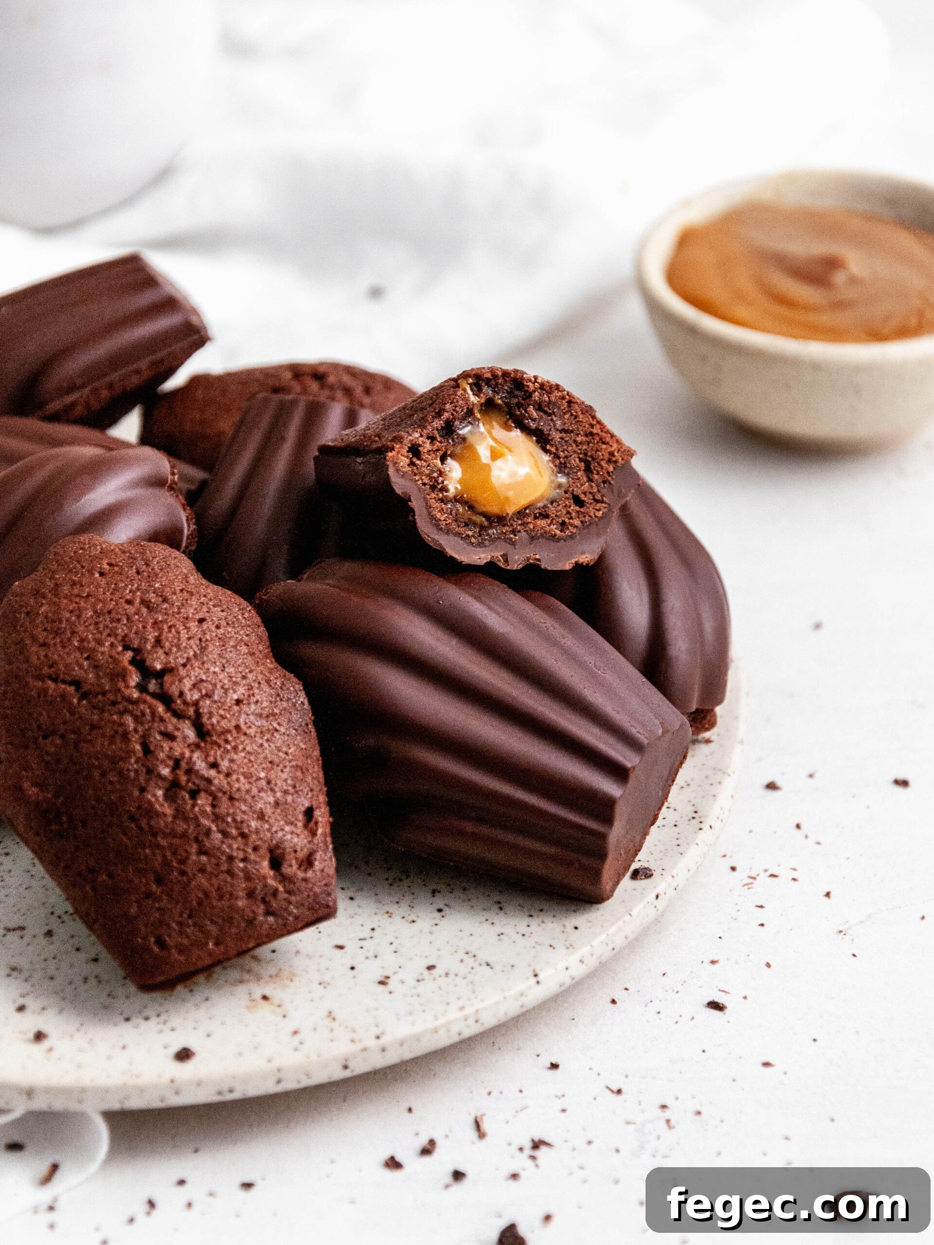 chocolate madeleines with Dulce de Leche on a plate.