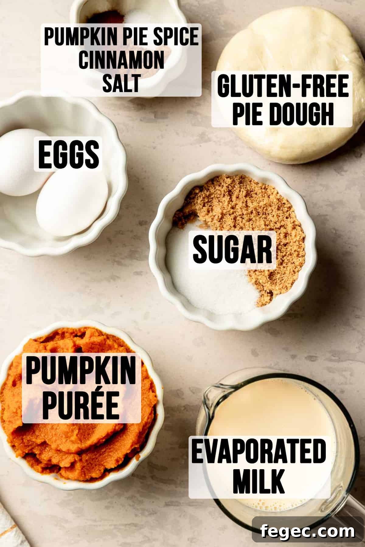 Ingredients for gluten-free pumpkin pie measured out in bowls.