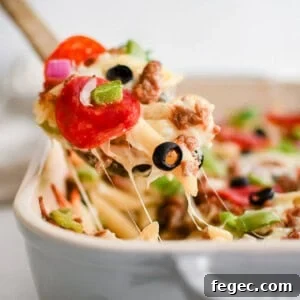 white pizza pasta bake in a pan with a spoon