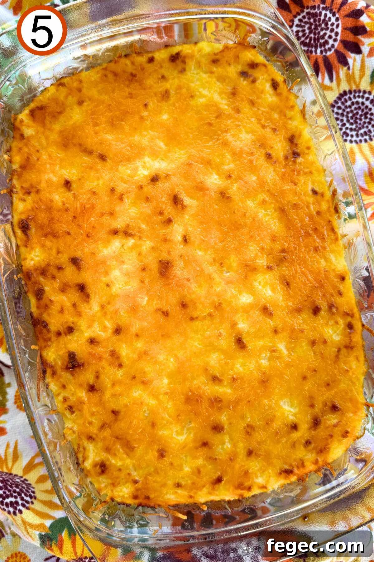 Baked spaghetti squash au gratin in a casserole dish.