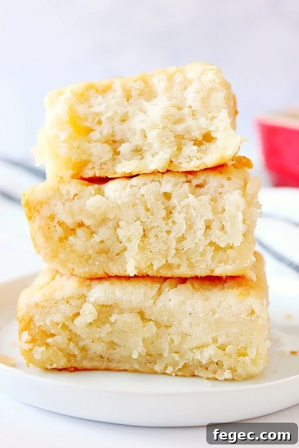7-UP Biscuits stacked up on white plate.