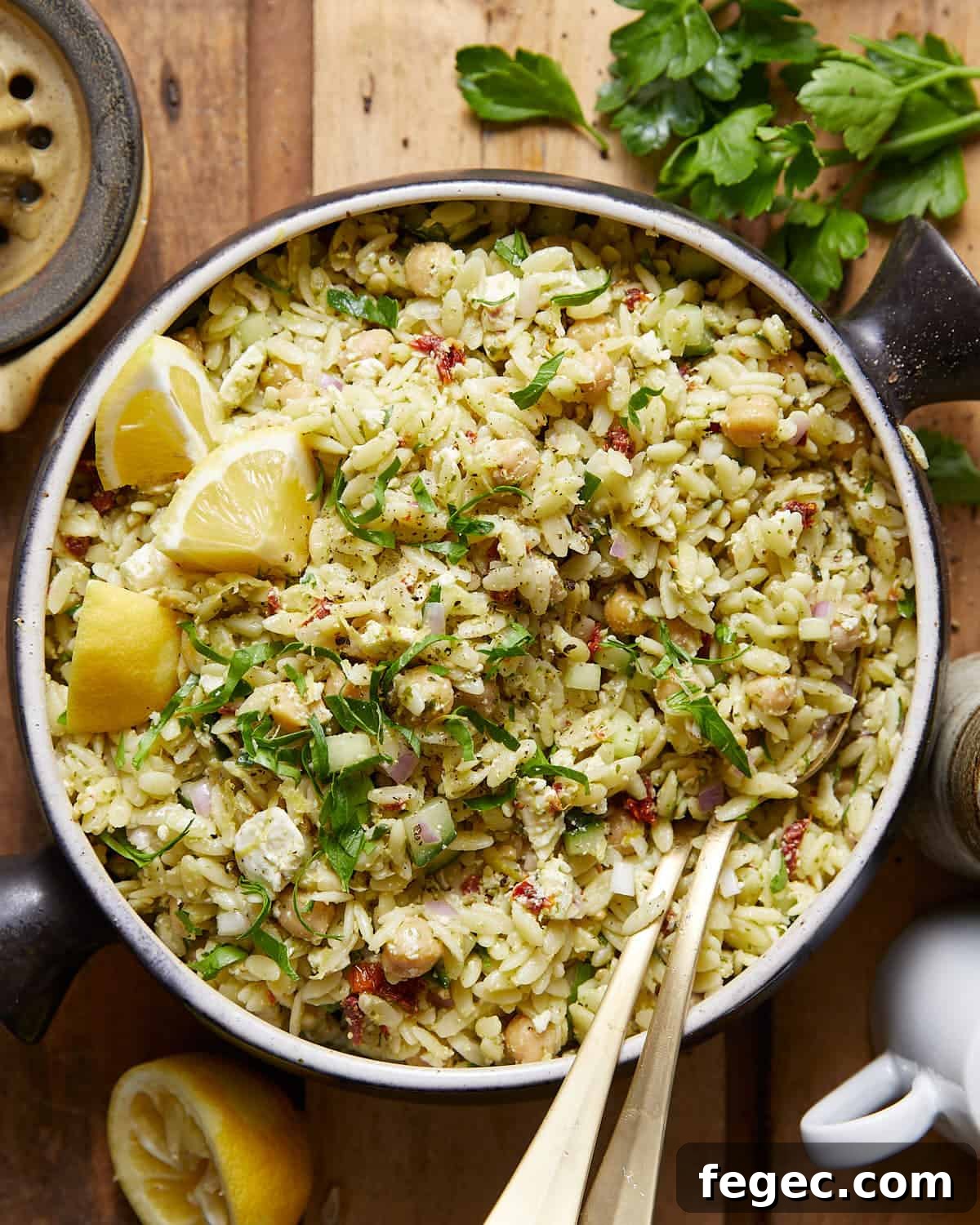 An overhead image of pesto orzo salad with garnish.