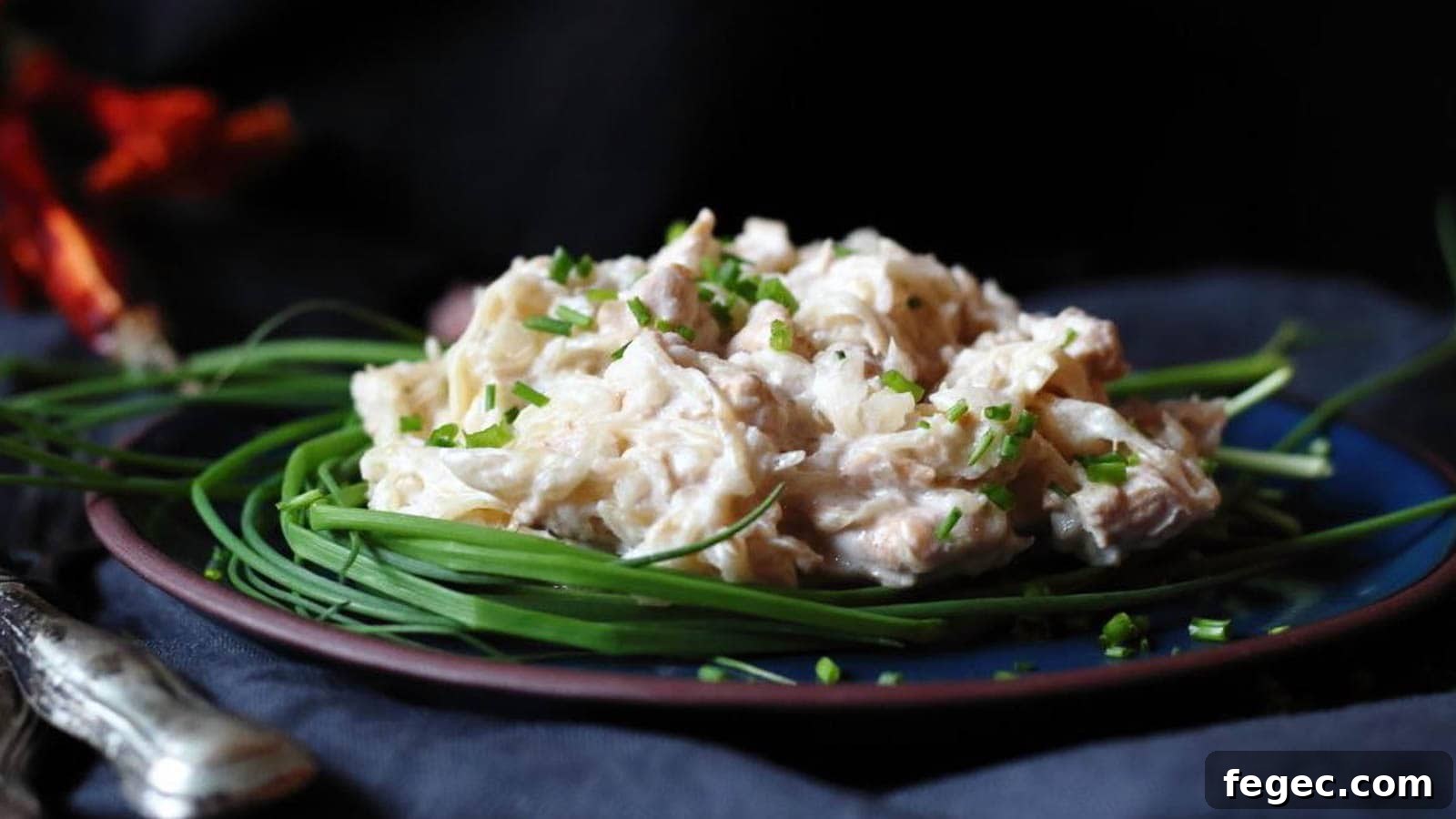 Low Carb Sauerkraut Chicken on a plate with chives.