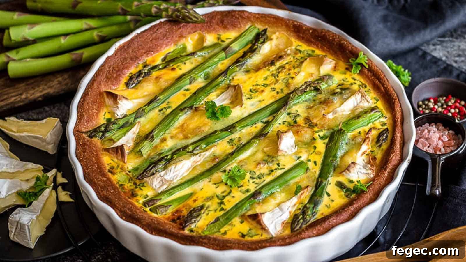 A white casserole with asparagus quiche.