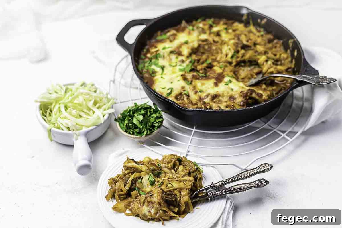 Beef casserole skillet with cabbage sides.