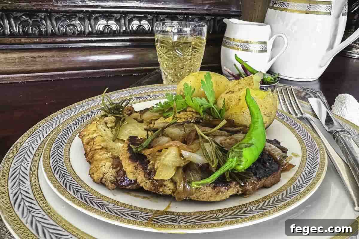A plate of pork fillet meal garnished with onions.