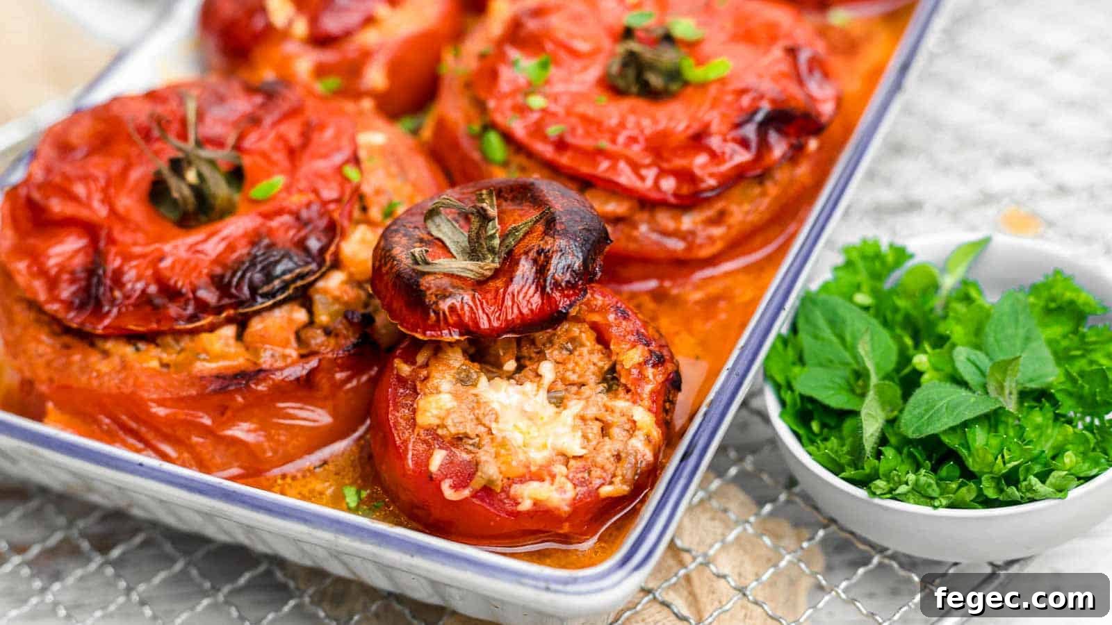 Stuffed Tomatoes inside white casserole.