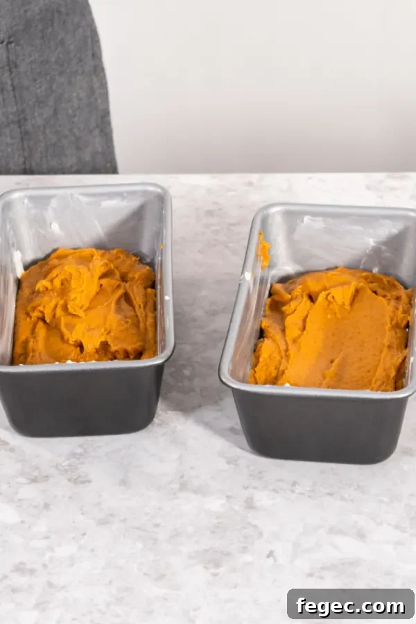 pumpkin bread batter in loaf pans 