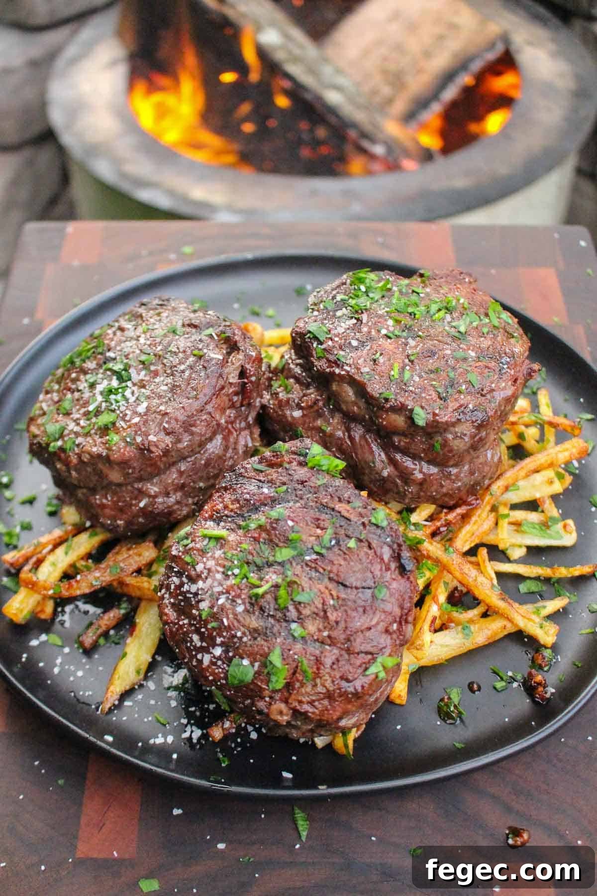 The Steak Frites with Garlic Chili Butter plated but before slicing the ribeye caps.
