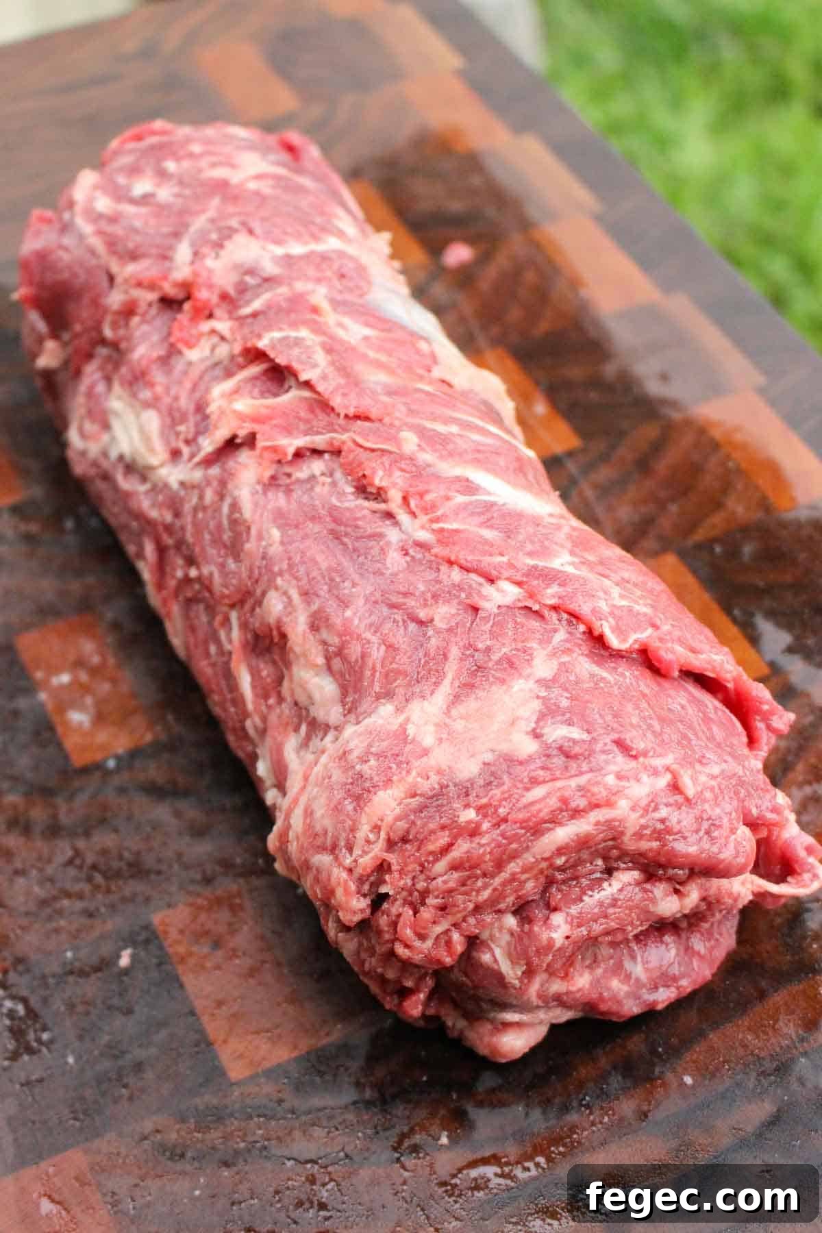 Rolling up the ribeye caps.
