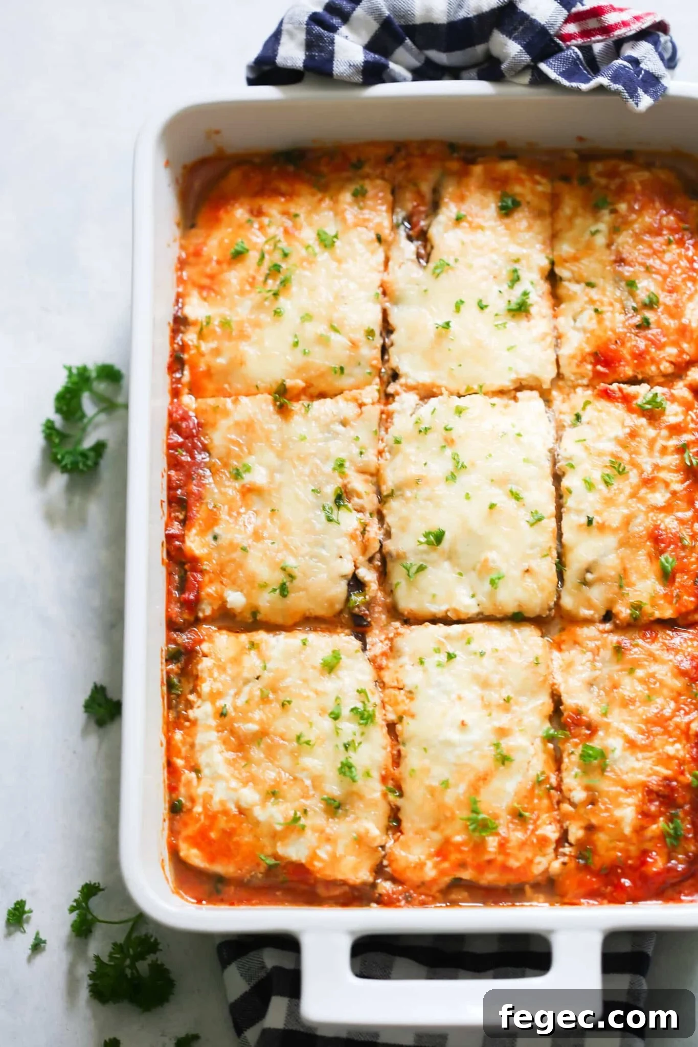 Low-carb eggplant lasagna in a large, white baking dish.